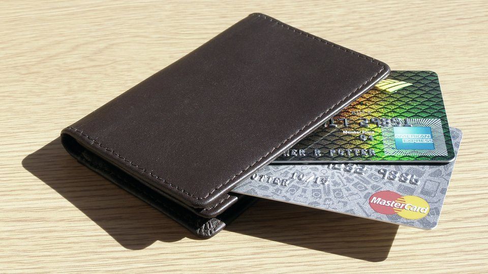 A wallet with credit cards tucked inside