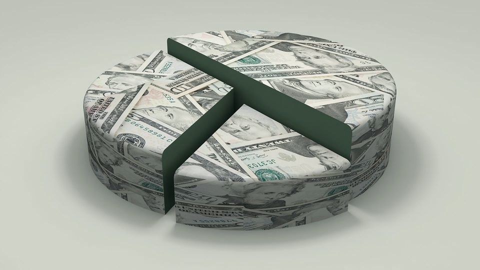 Banknotes stacked into a round shape and cut like a pie chart