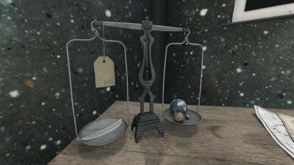 An antique balance scale on a wooden table