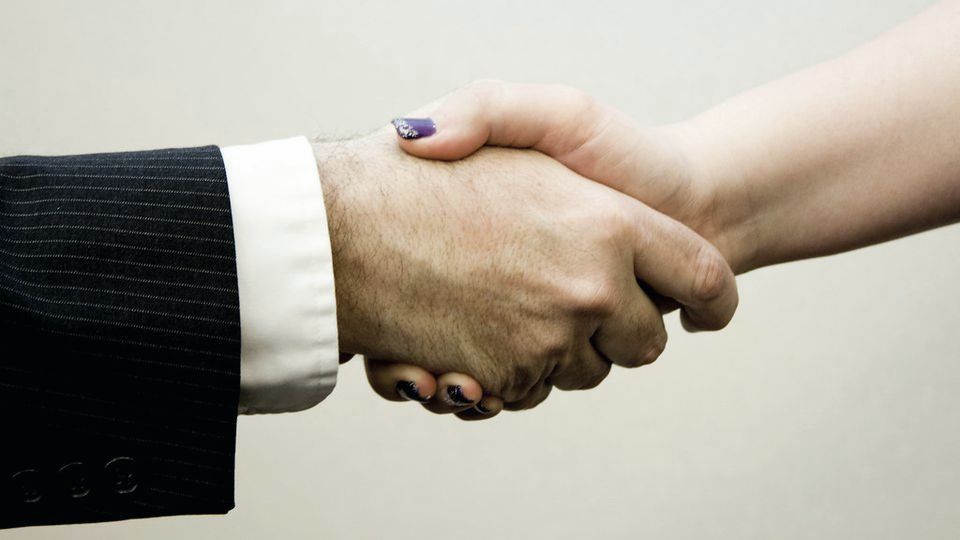Two people shaking hands
