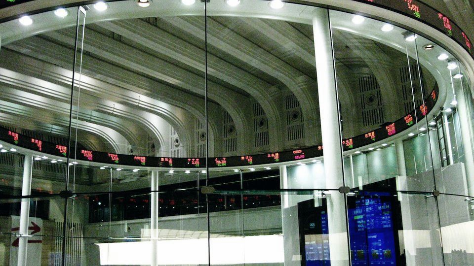 Stock exchange hall with an electronic ticker ring running around the ceiling